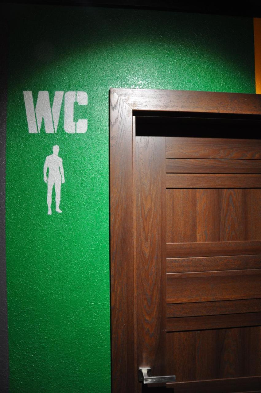 Full House Capsule Hostel Rivne Exteriör bild A sign for a men's toilet