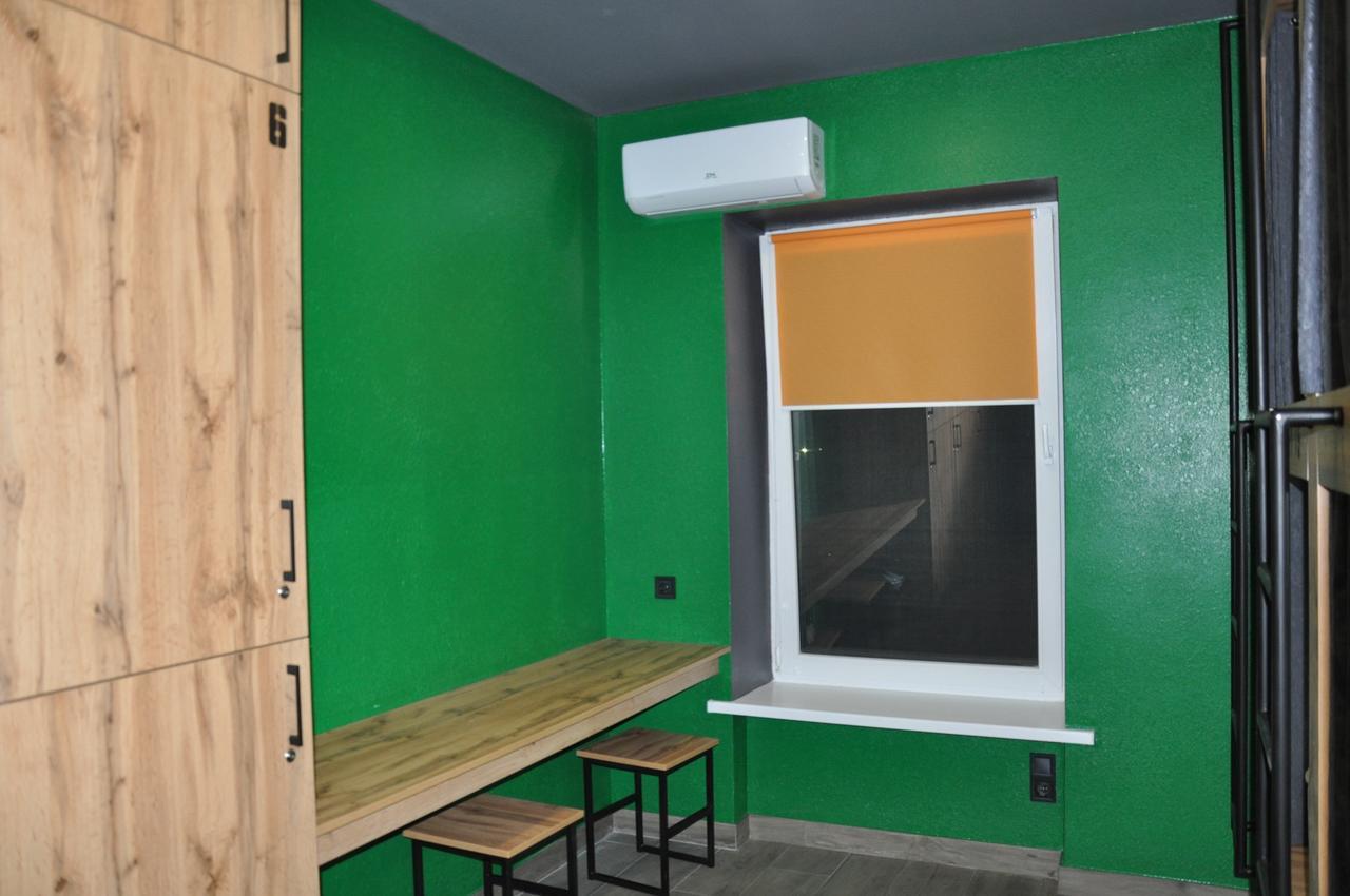 Full House Capsule Hostel Rivne Exteriör bild A window with a window screen