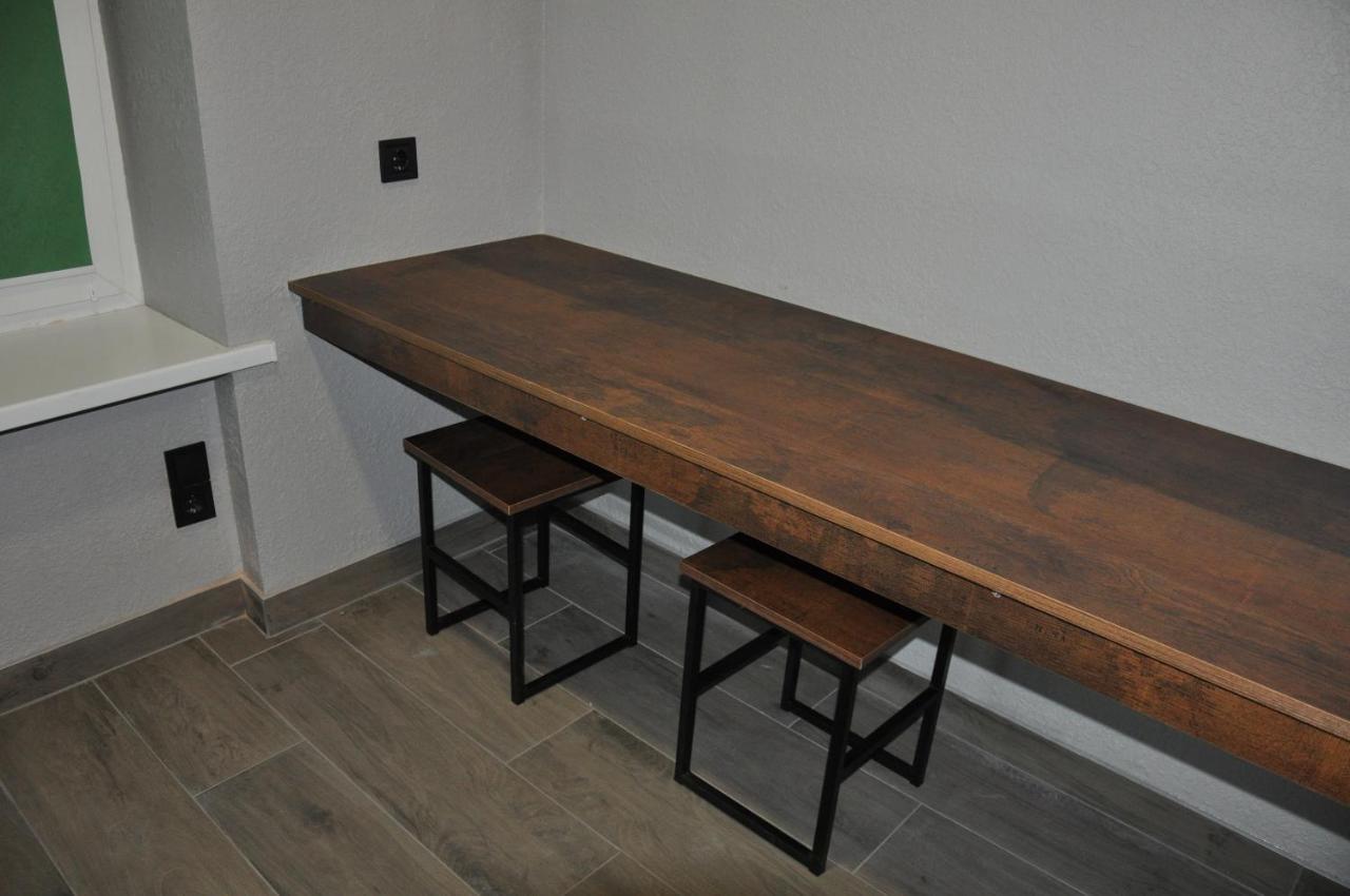 Full House Capsule Hostel Rivne Exteriör bild A bar table