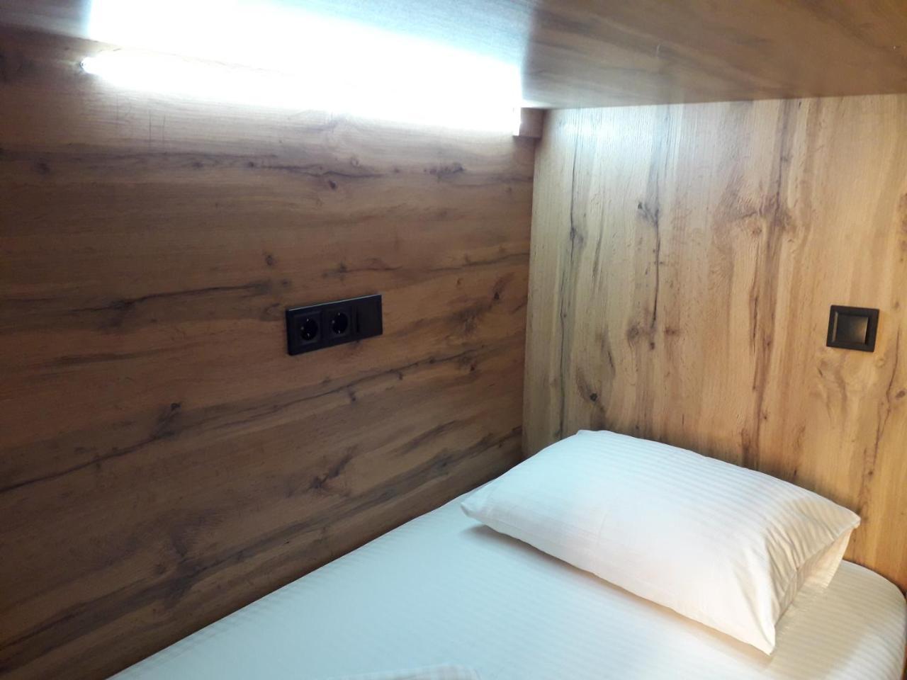 Full House Capsule Hostel Rivne Exteriör bild A single bed in a capsule hotel